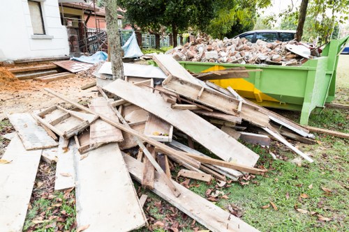 Professionals removing a sofa from a modern North London home